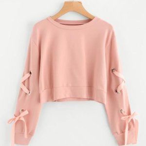 EYELET LACE UP SLEEVE CROP SWEATSHIRT